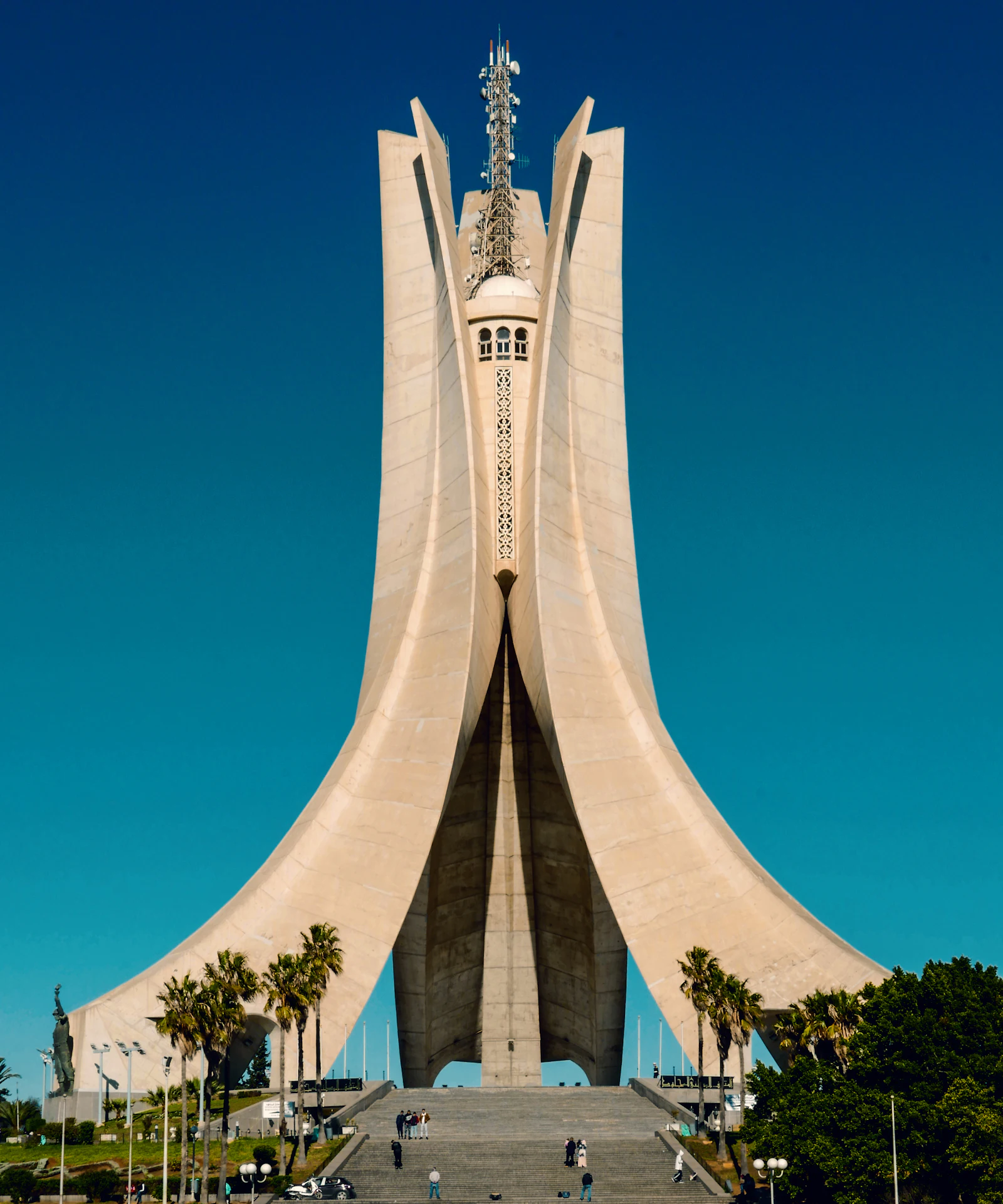 The Martyrs’ Memorial (Maqam Echahid) in Algiers, three concrete palm leaves against a blue sky